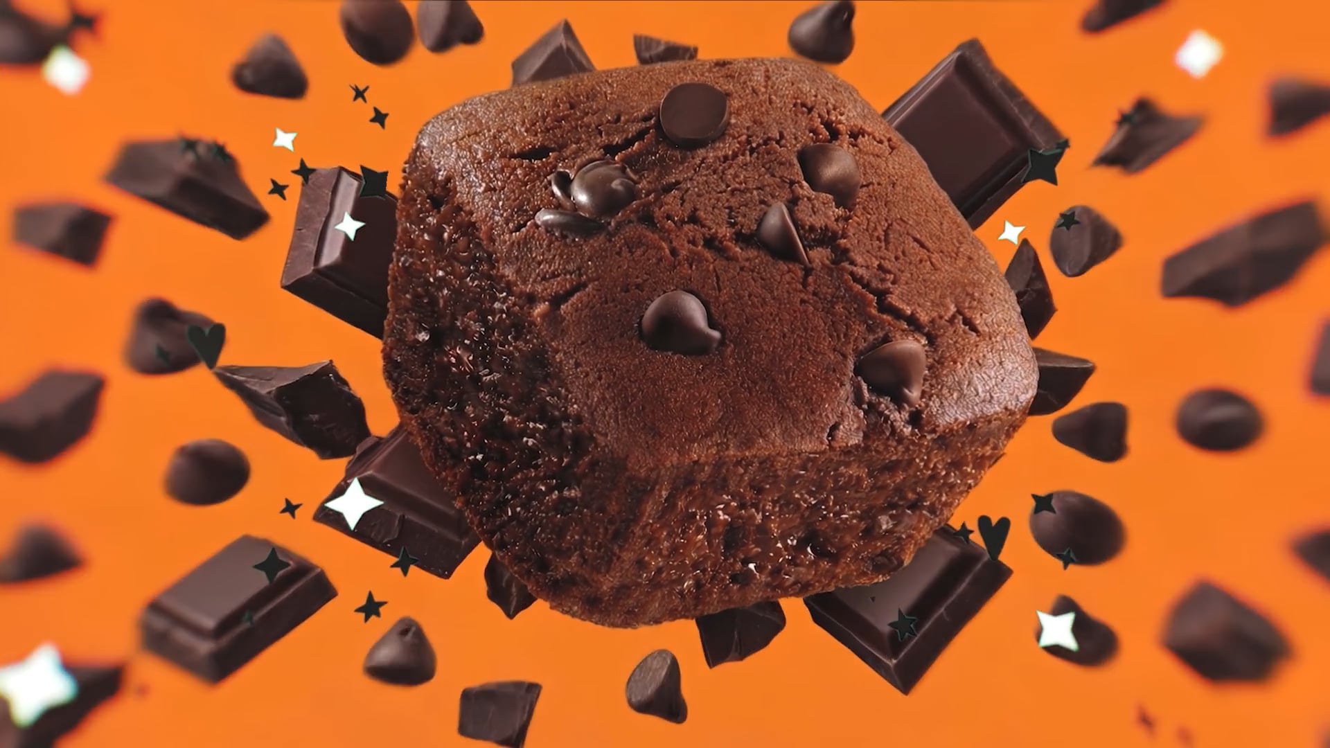 Brownie al cioccolato con esplosione di pezzi di cioccolato sullo sfondo