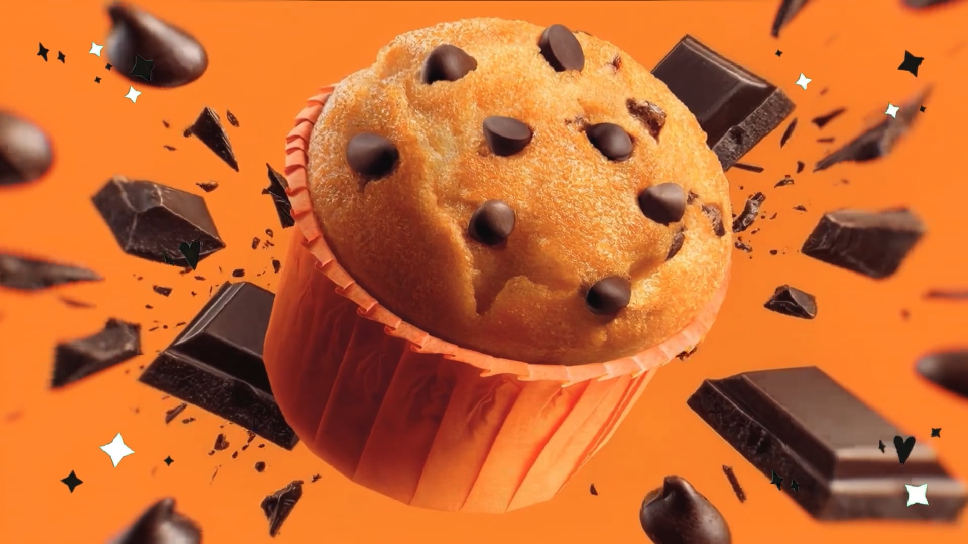 Muffin con esplosione di pezzi di cioccolata sullo sfondo